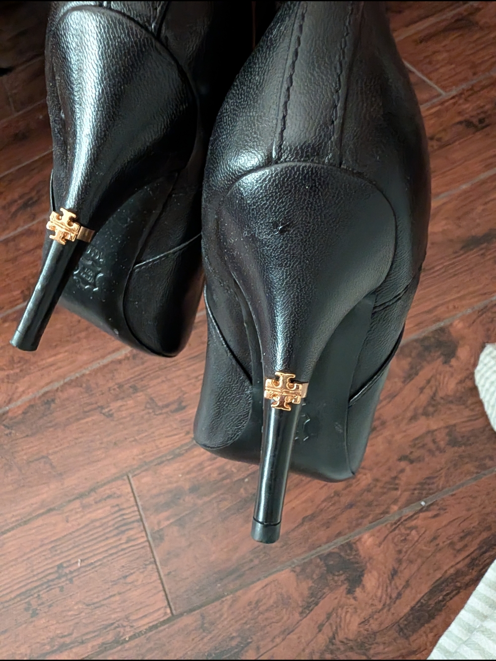 Tory Burch Black Leather Stiletto Pumps with Gold Logo Accent